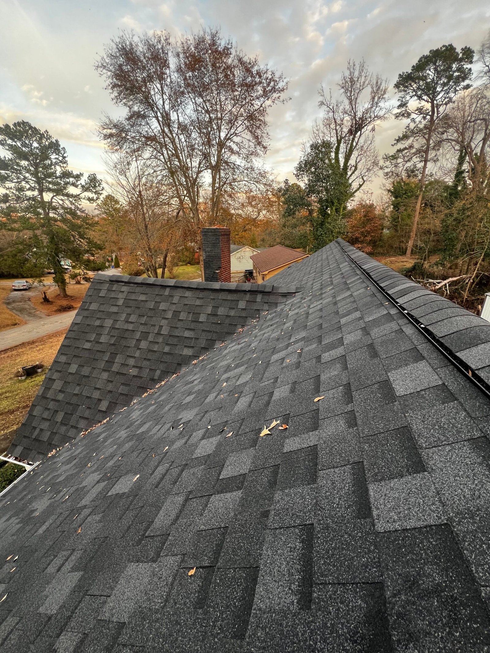 House roof shingles installation side view - IAC Construction