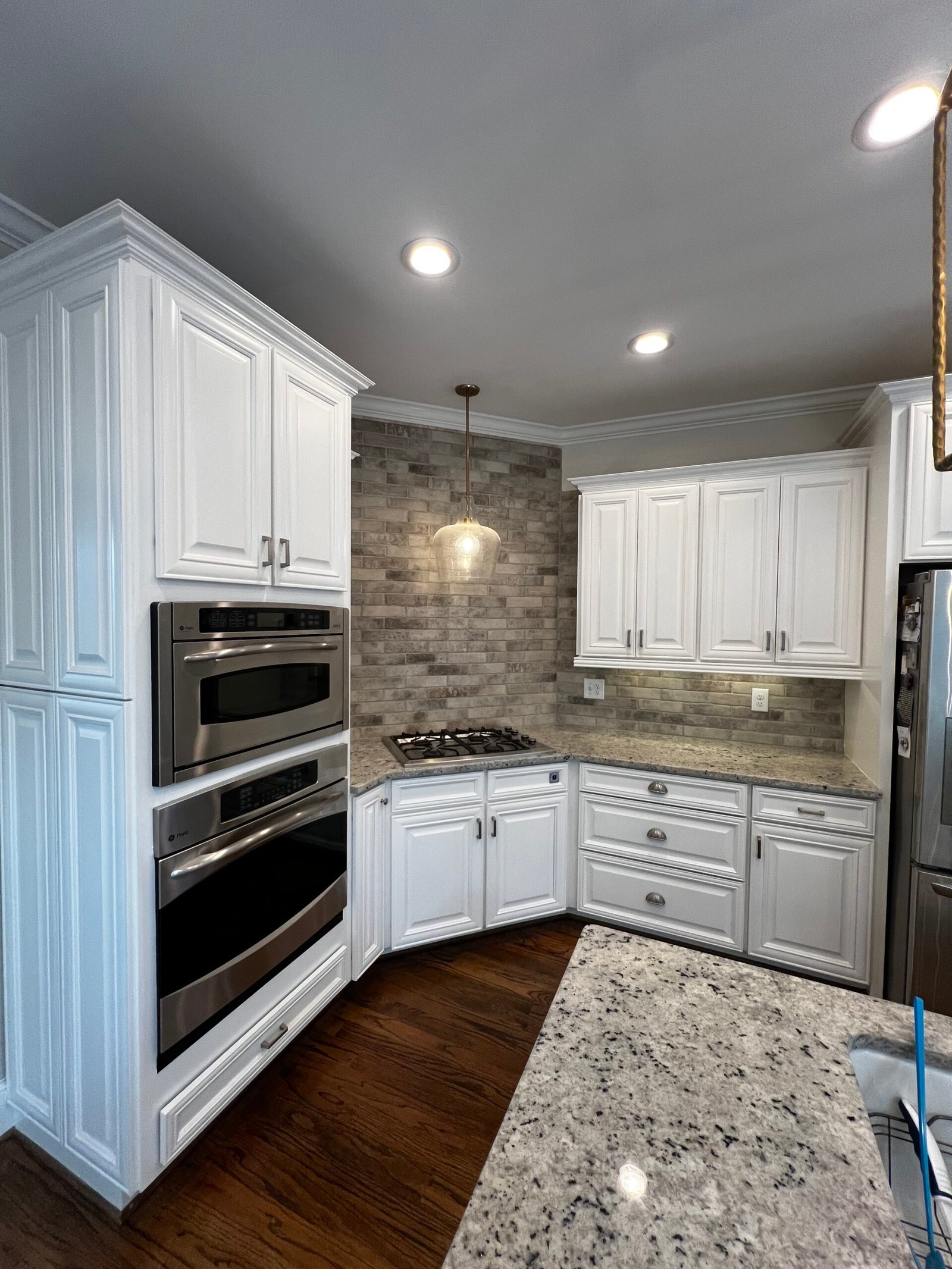 IAC Construction kitchen remodel with modern white cabinets and backsplash