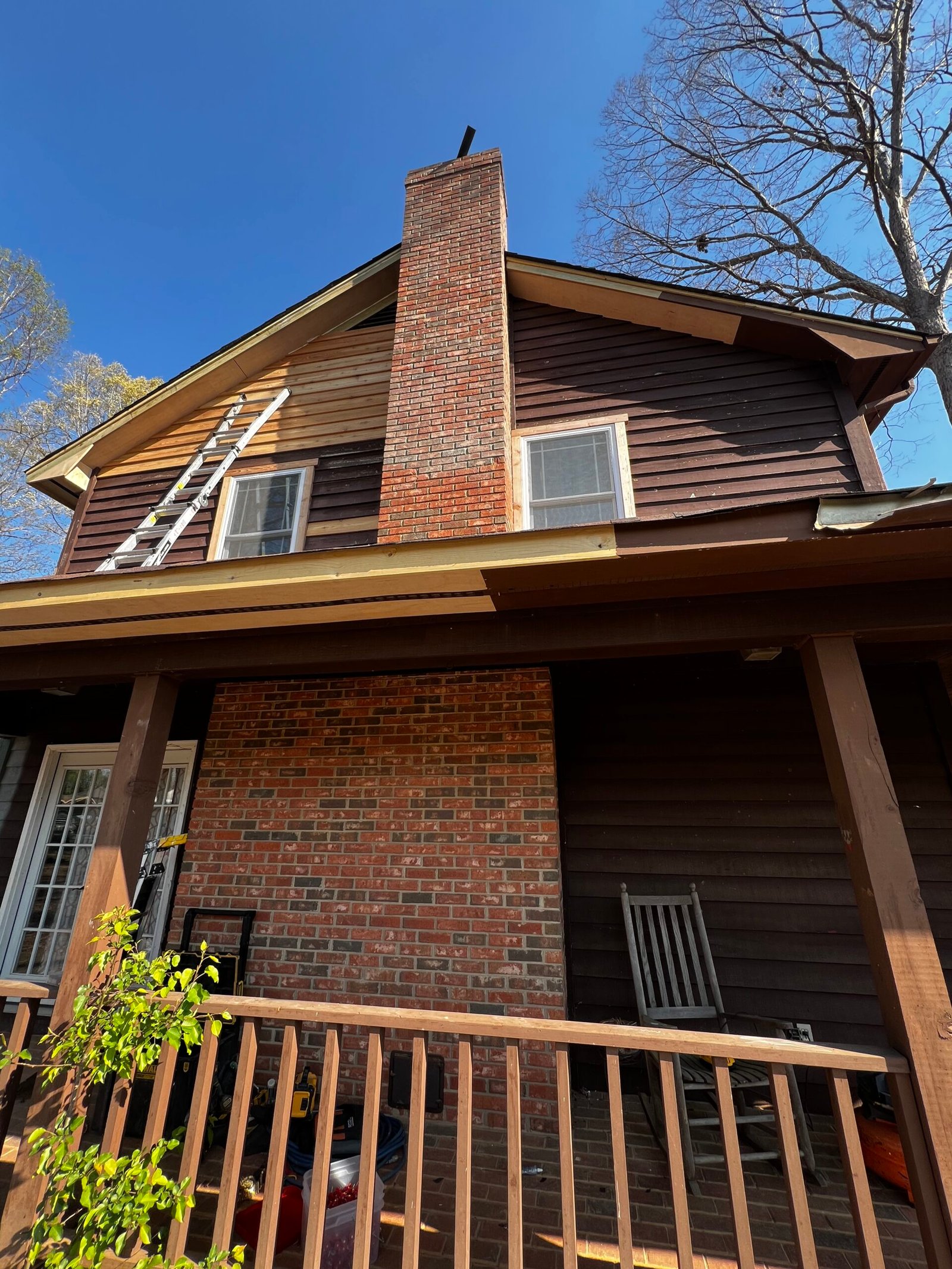 Roof shingles installation during restoration - IAC Construction