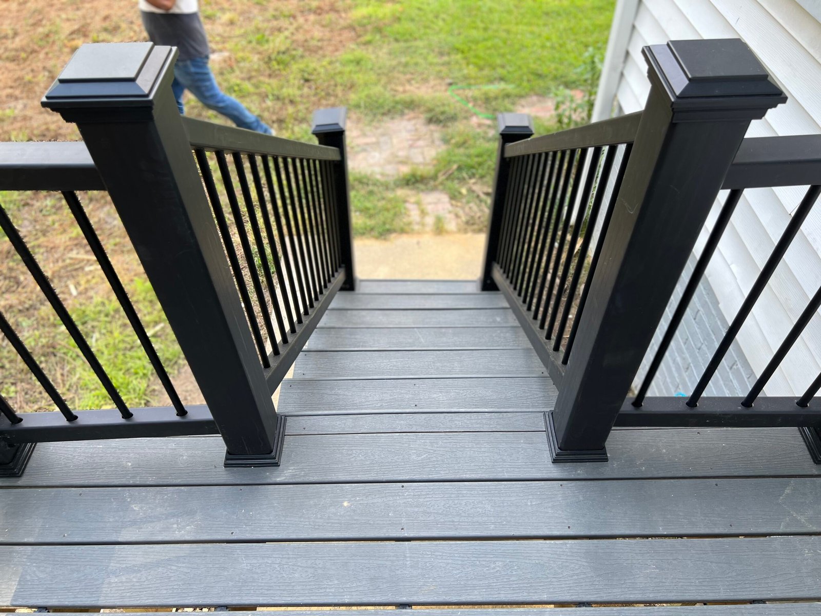 IAC Construction custom outdoor deck stairs with black handrails