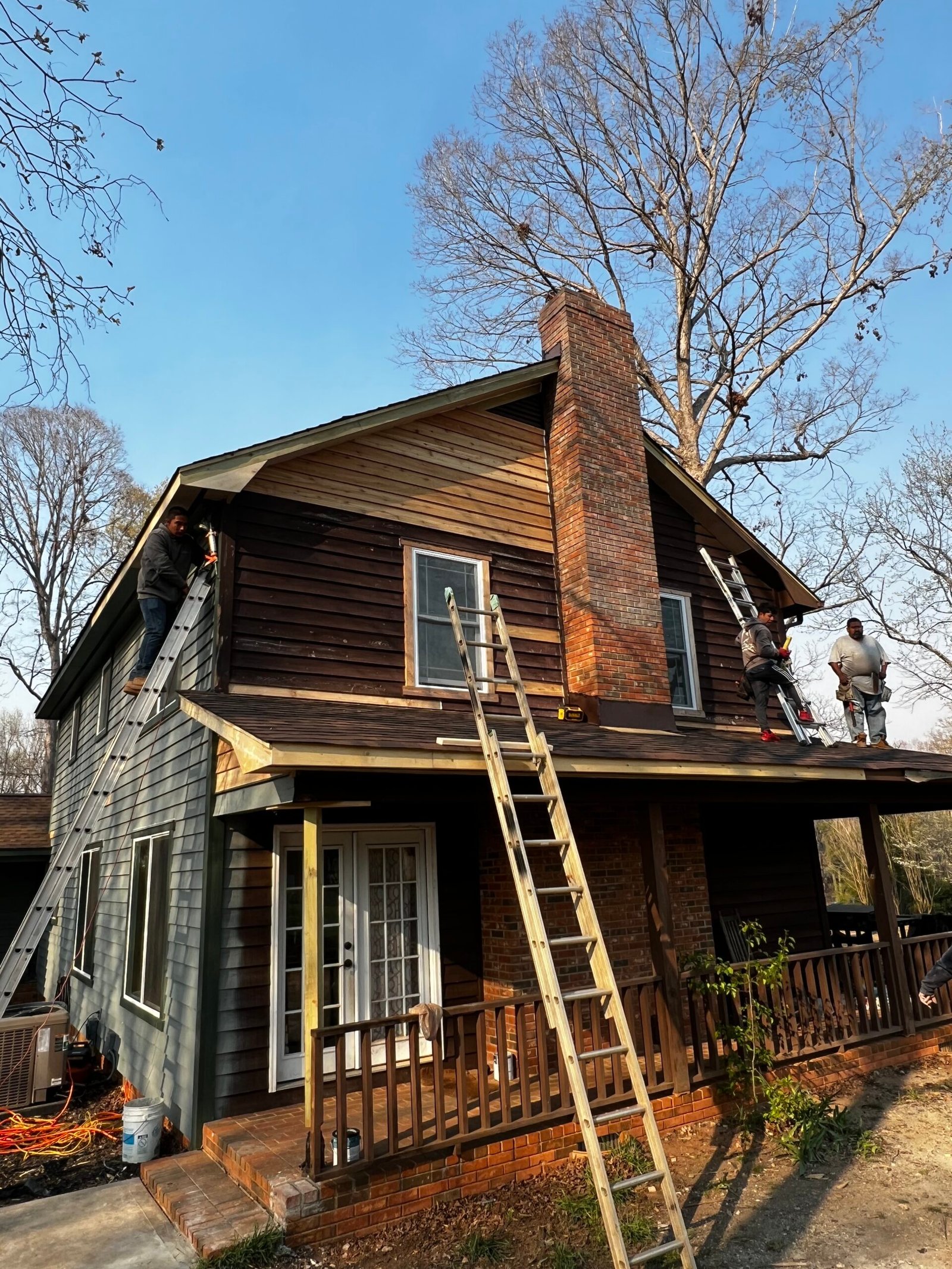 Two story house roof damage before repair - IAC Construction