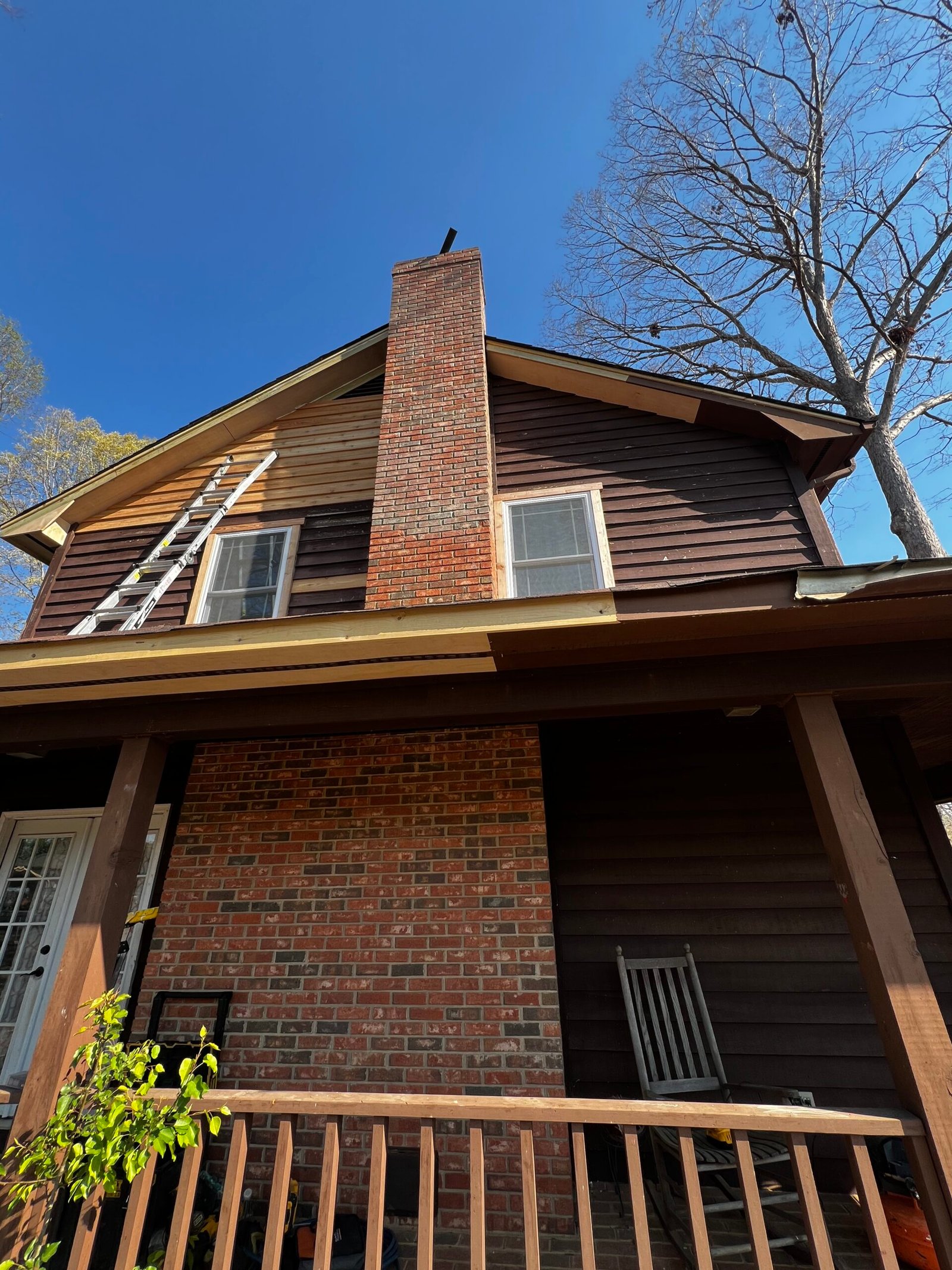 Completed roof restoration with chimney view - IAC Construction